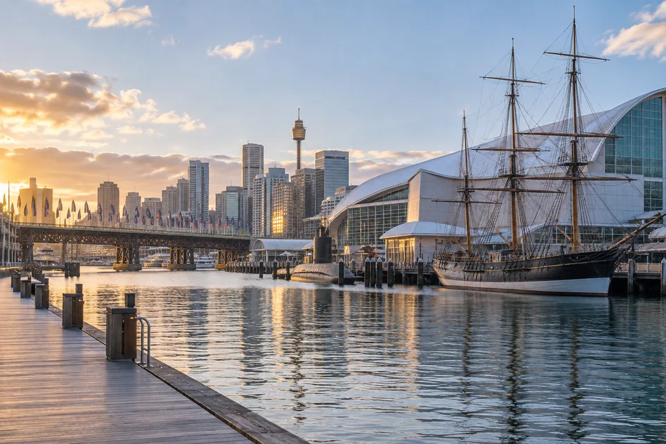 Generated editorial illustration of the Australian National Maritime Museum waterfront, vessels and Pyrmont Bridge in Darling Harbour.